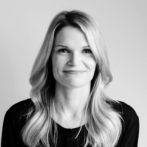 Black and white image of a lady in a black shirt