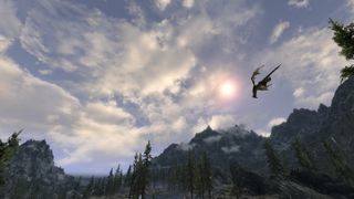 Best Skyrim mods — a dragon flies overhead through an overhauled skybox provided by the Climates of Tamriel mod