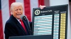 WASHINGTON, DC - APRIL 02: U.S. President Donald Trump holds up a chart while speaking during a &ldquo;Make America Wealthy Again&rdquo; trade announcement event in the Rose Garden at the White House.