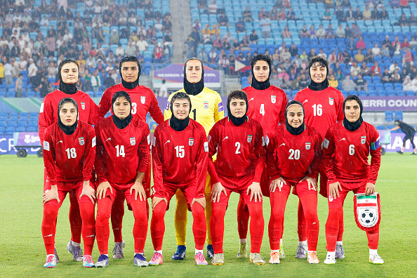 Iran's team pose for a group photo before the AFC Women's Asian Cup Australia 2026 match between Iran and the Philippines in Gold Coast on March 8, 2026. The son of the late shah urged Canberra on March 9 to protect the Iranian women's football team, who were branded "wartime traitors" after refusing to sing the national anthem while playing in Australia. 