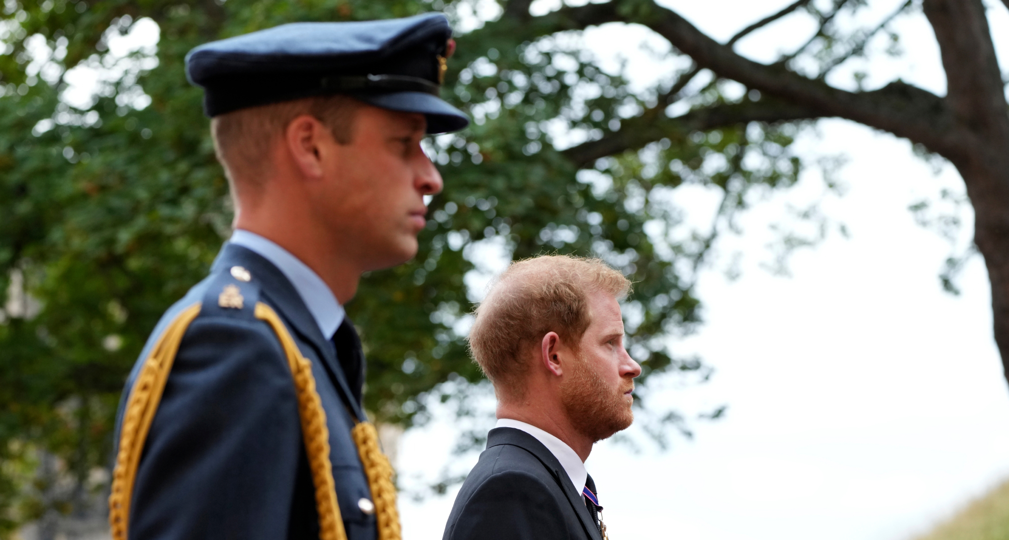 Prince William and Prince Harry standing next to each other at Queen Elizabeth's funeral