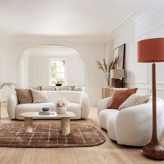 white boucle sofas in neutral living room