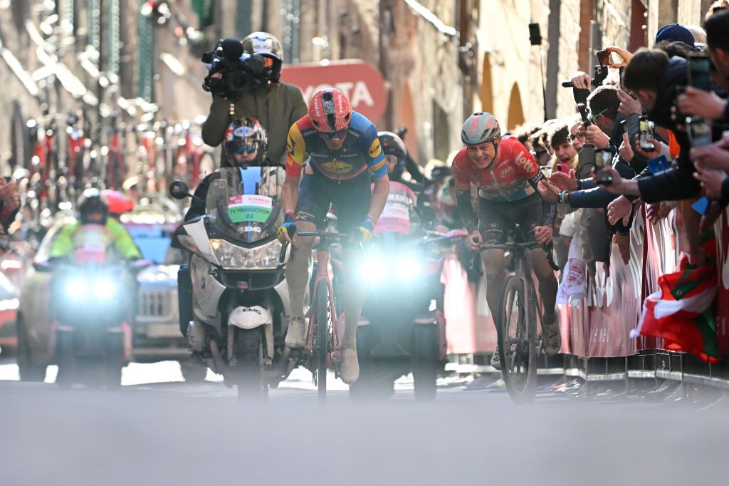 SIENA ITALY MARCH 02 LR Toms Skujins of Latvia and Team Lidl Trek and Maxim Van Gils of Belgium and Team Lotto Dstny compete during the 18th Strade Bianche 2024 Mens Elite a 215km one day race from Siena to Siena 320m UCIWT on March 02 2024 in Siena Italy Photo by Luc ClaessenGetty Images