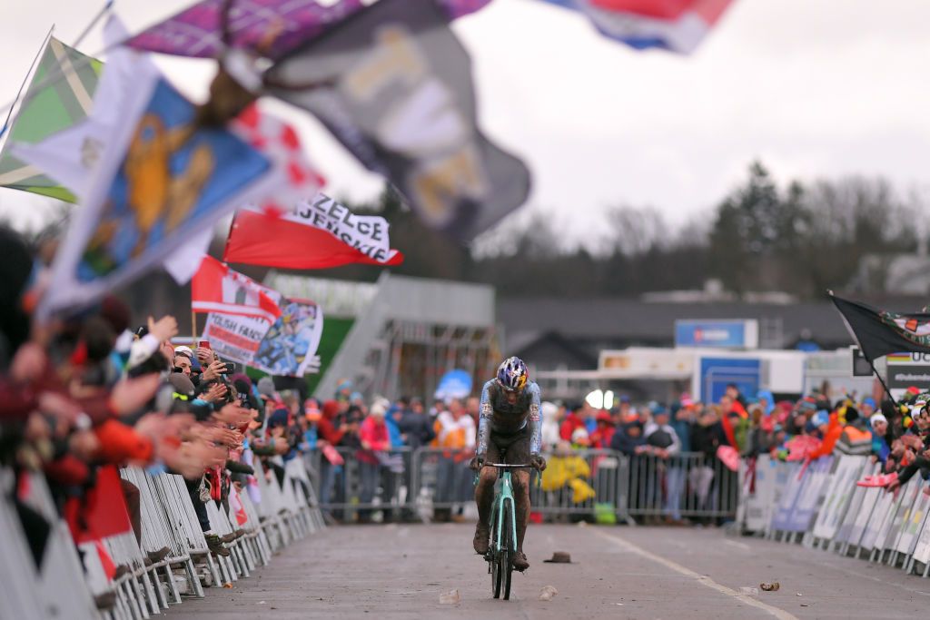 A dejected Wout Van Aert comes to the line