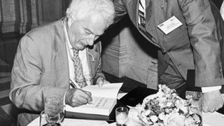 Author Joseph Heller signing a copy of Catch 22