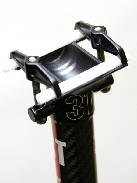 The separate upper clamps and lower cradle make for frustrating saddle installation