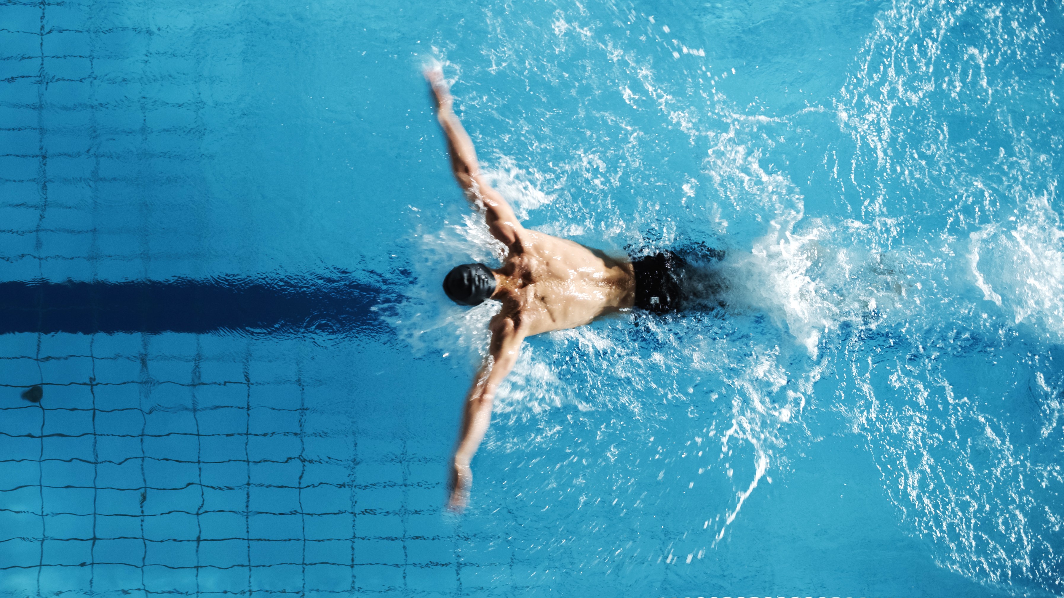 a photo of a man doing butterfly stroke