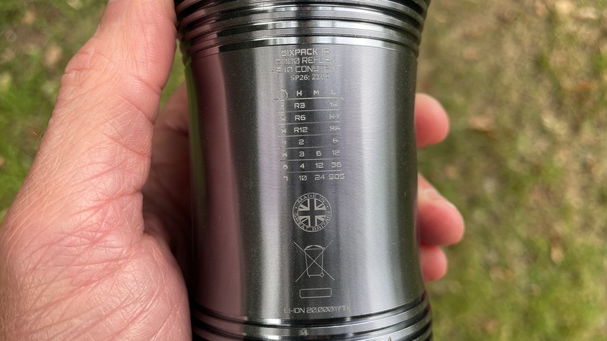 An Exposure Six Pack 15 MTB light with detail of its laser etched run-time chart