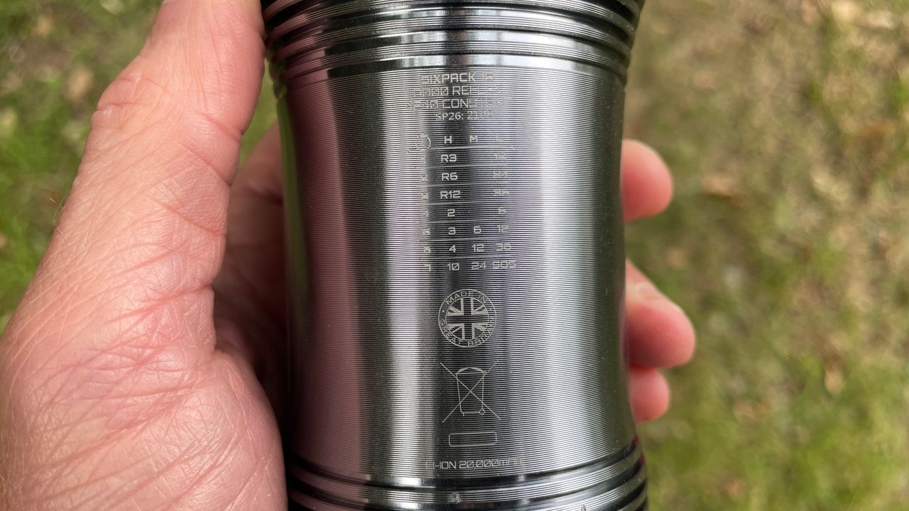 An Exposure Six Pack 15 MTB light with detail of its laser etched run-time chart