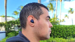 Our reviewer wearing the Jabra Elite 7 Active after a run