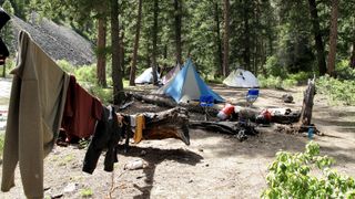 how to wash clothes while camping: washing line in campsite