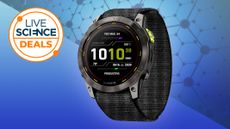 Garmin enduro 2 smart watch on a blue background with a live science deals logo in the top left corner