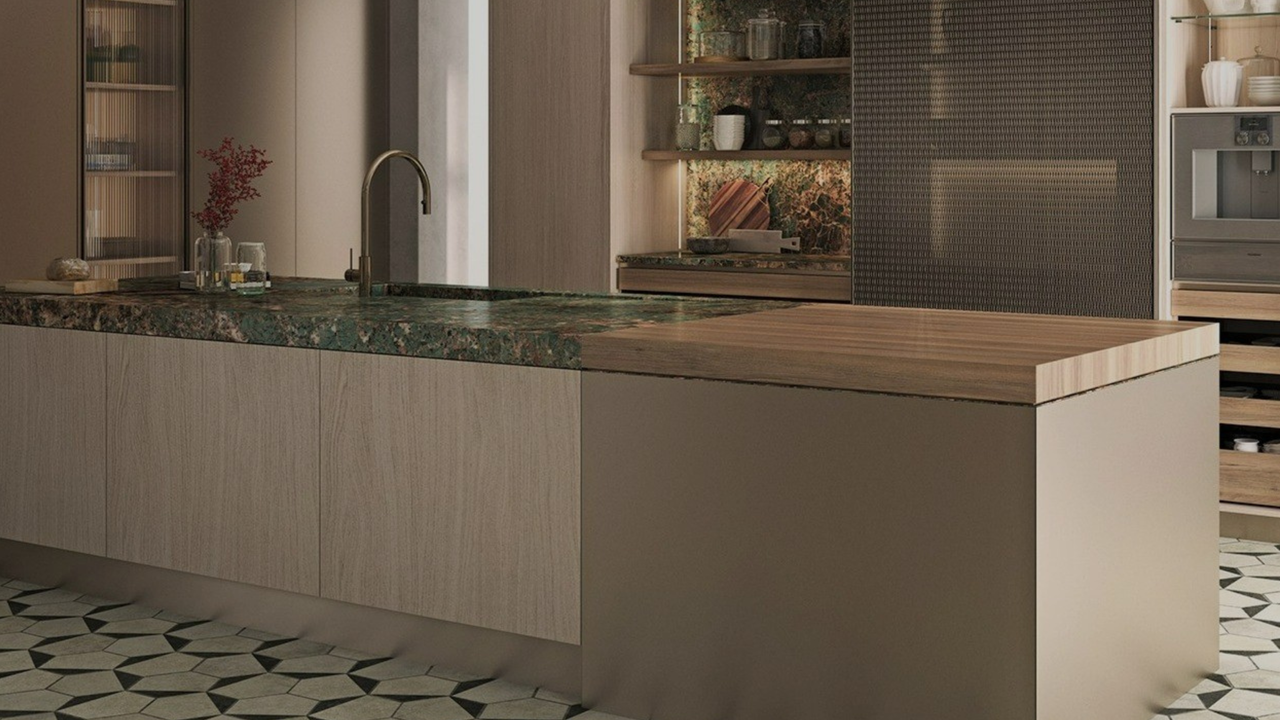 stainless steel and light oak kitchen island with a green marble and wood combination counter