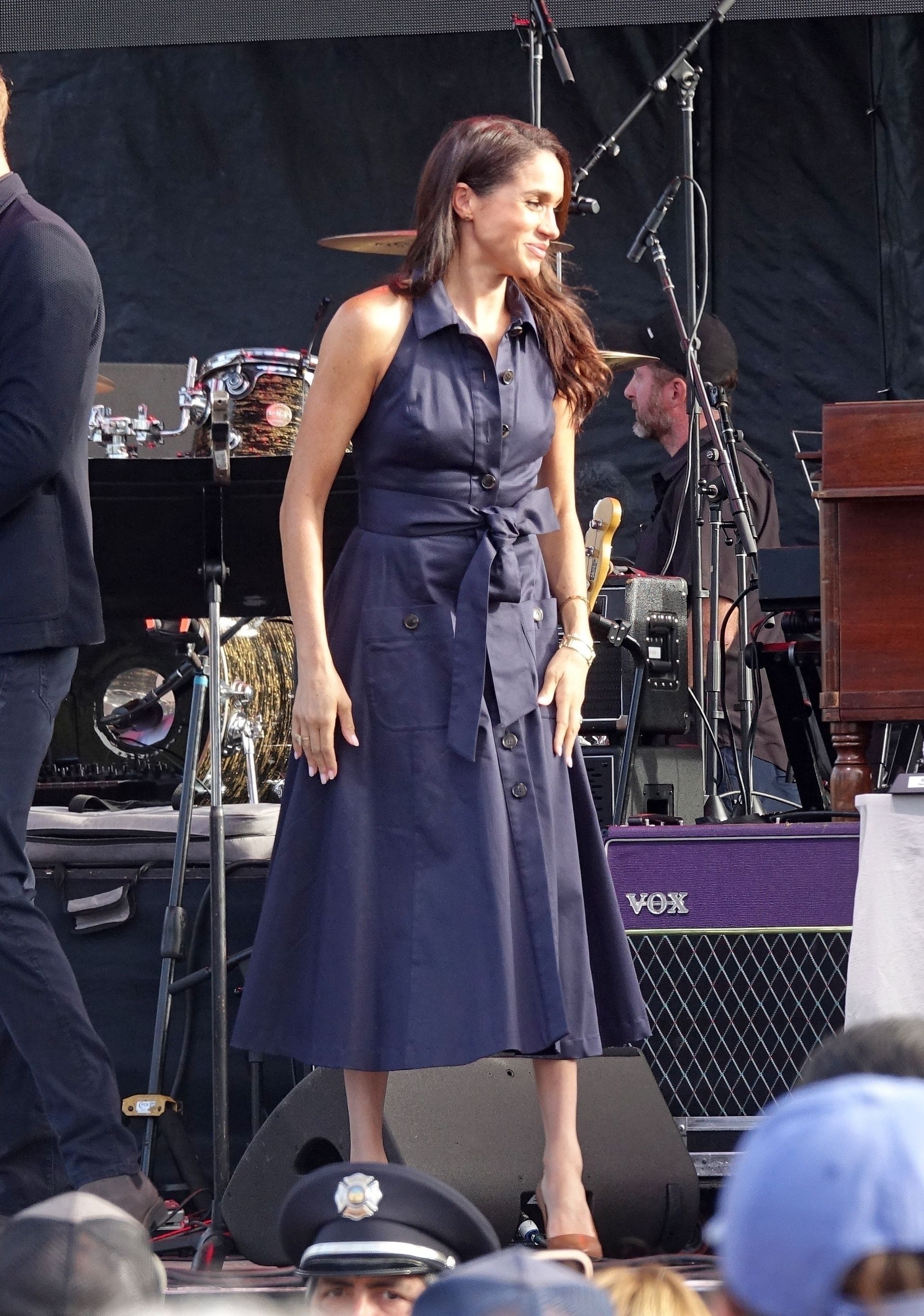 Prince Harry and Meghan Markle present awards on stage with a dog and First Responders at Kevin Costner’s annual ‘Rock for First Responders’ One805 Live! Event