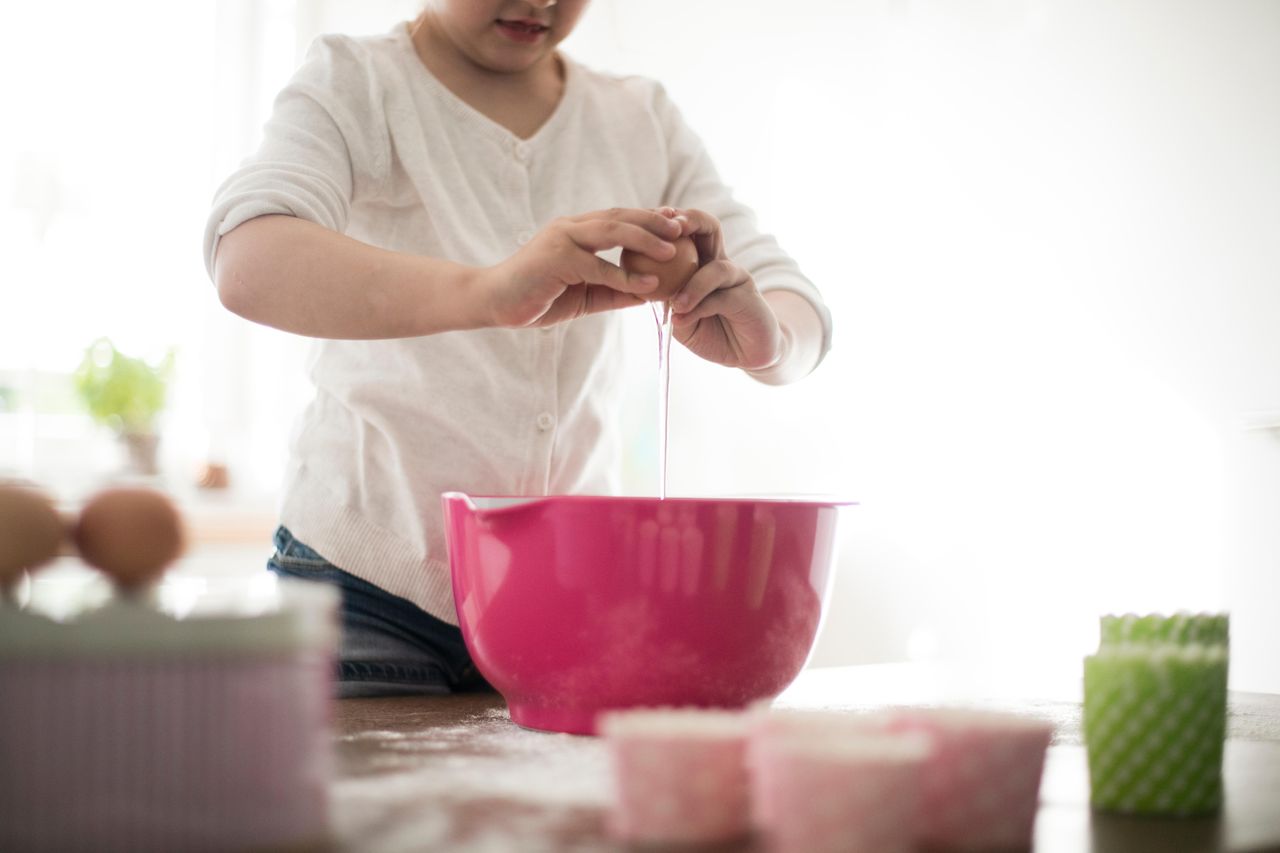 Girl separating eggs 