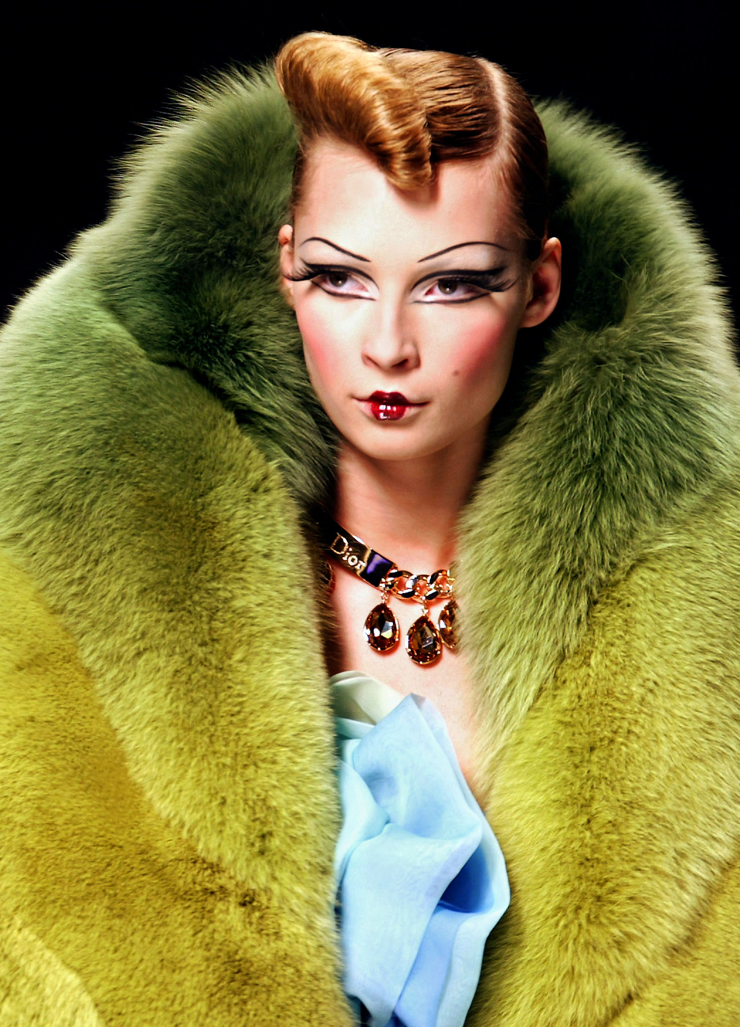 A model presents a creation by British designer John Galliano for Christian Dior during the presentation of Autumn/Winter 2004-05 collections at the Paris fashion week 03 March 2004. AFP JEAN-PIERRE MULLER (Photo by JEAN-PIERRE MULLER / AFP)