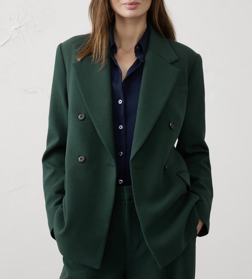 A model in a green blazer