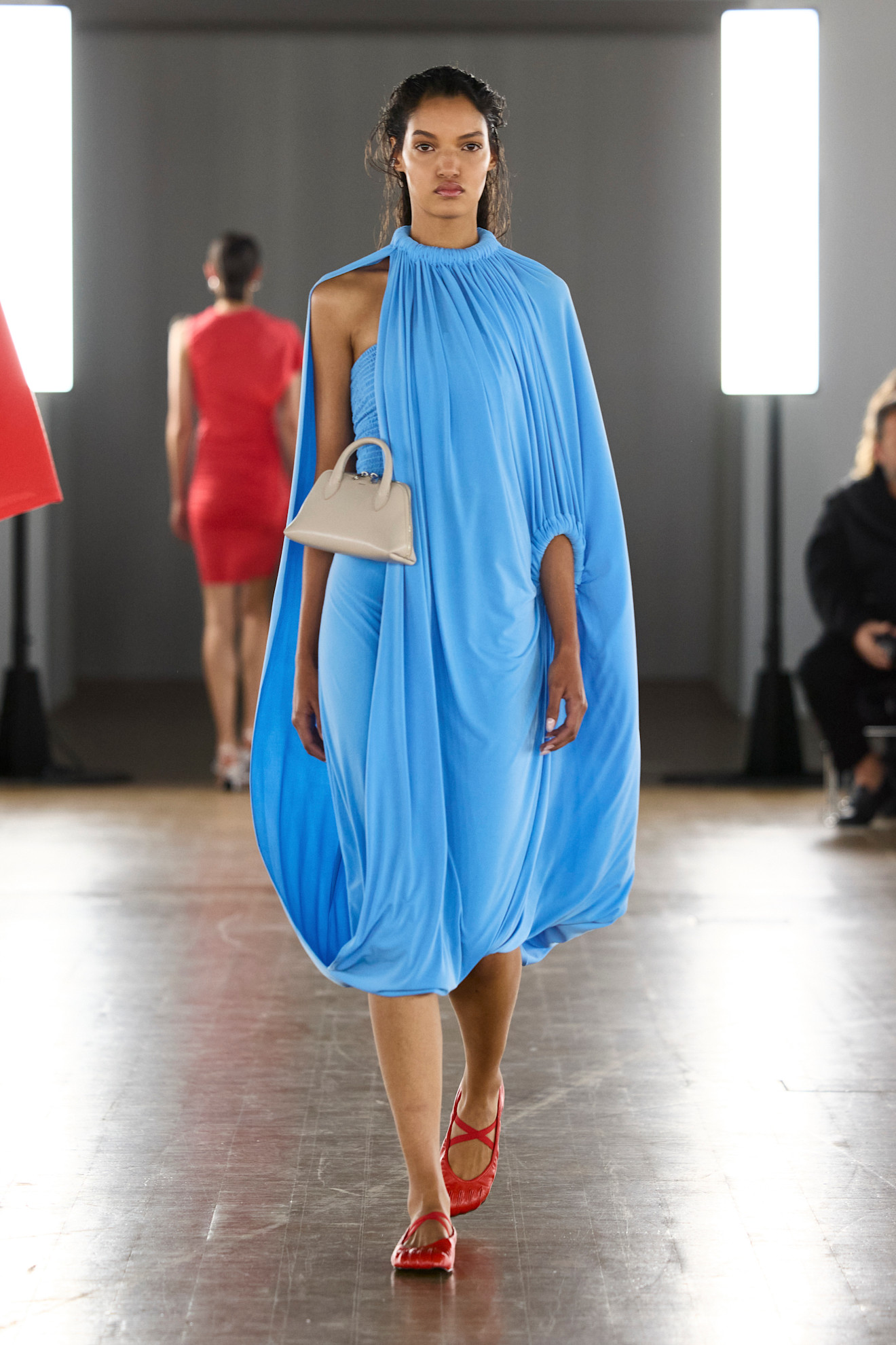 A model wore sky blue and strawberry red on the Coperni Spring 2026 runway