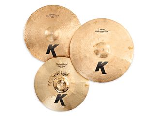 Zildjian's two new K Custom rides (top) are medium-thin with a special proprietary satin giving them a muted old-gold look; the 19" Trash-Smash (bottom) has eight hammered and slightly raised 'spokes' radiating across its body.
