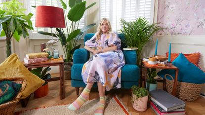Fearne Cotton in her home, in front of a window and with colourful furniture around her