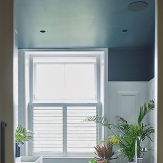 Small room with dark grey painted ceiling