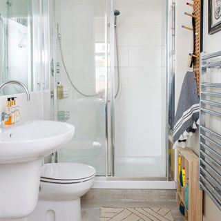 bathroom with white sink and handheld shower