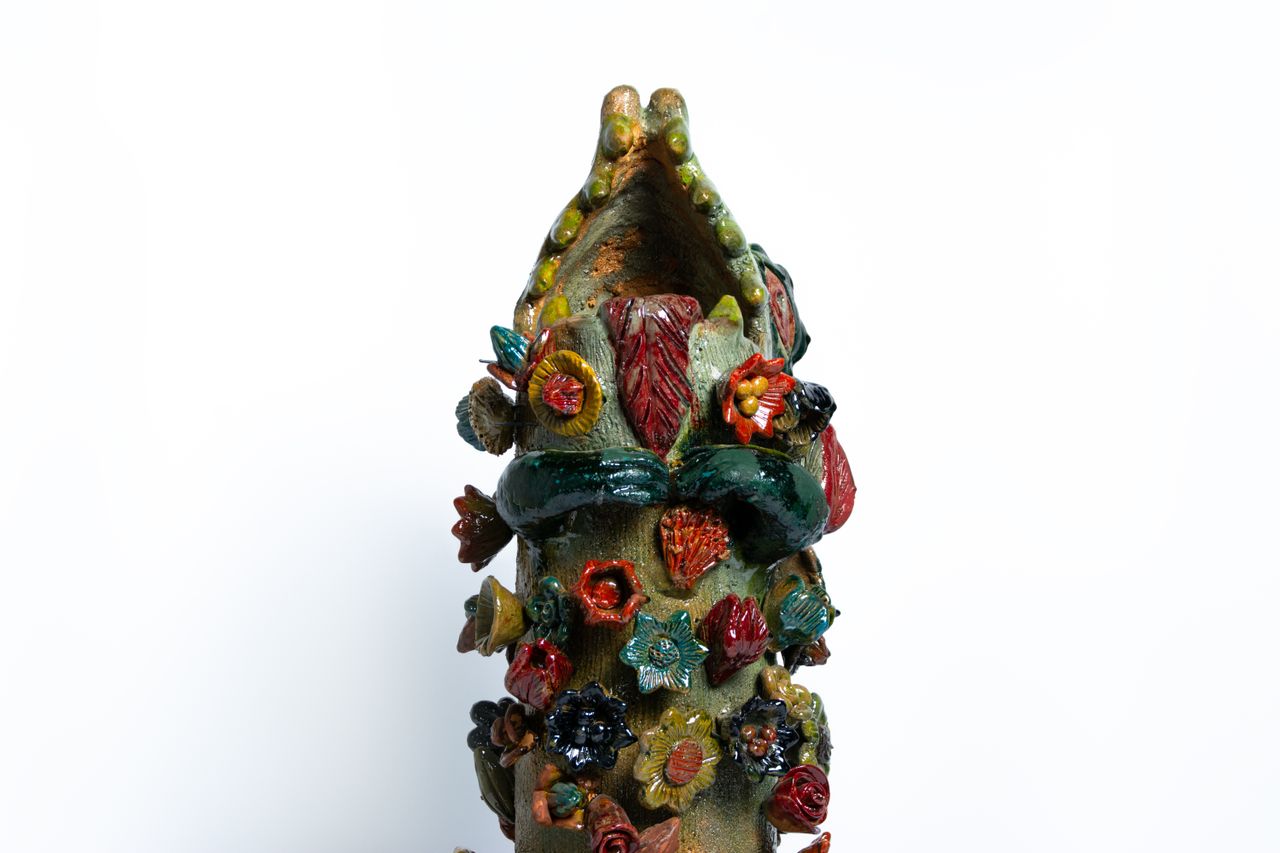 Colourful animal head ceramic vessels
