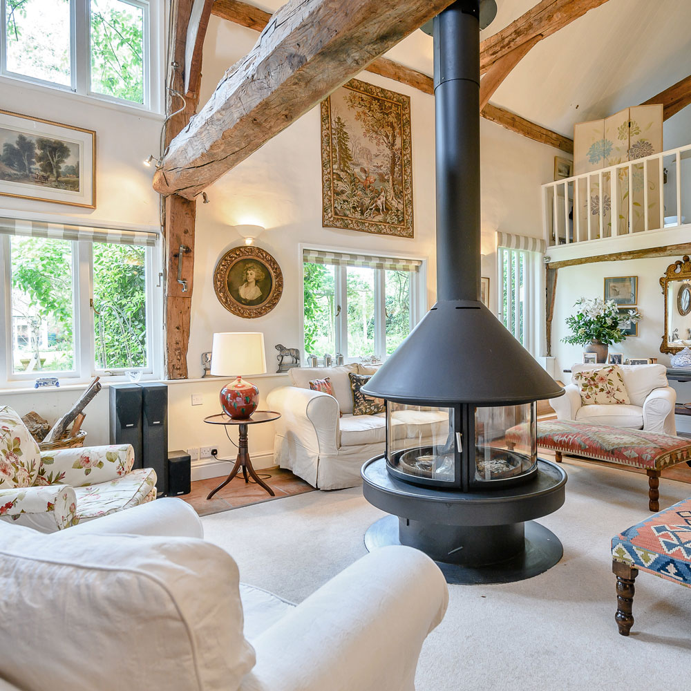 living room with white sofa and wooden beam