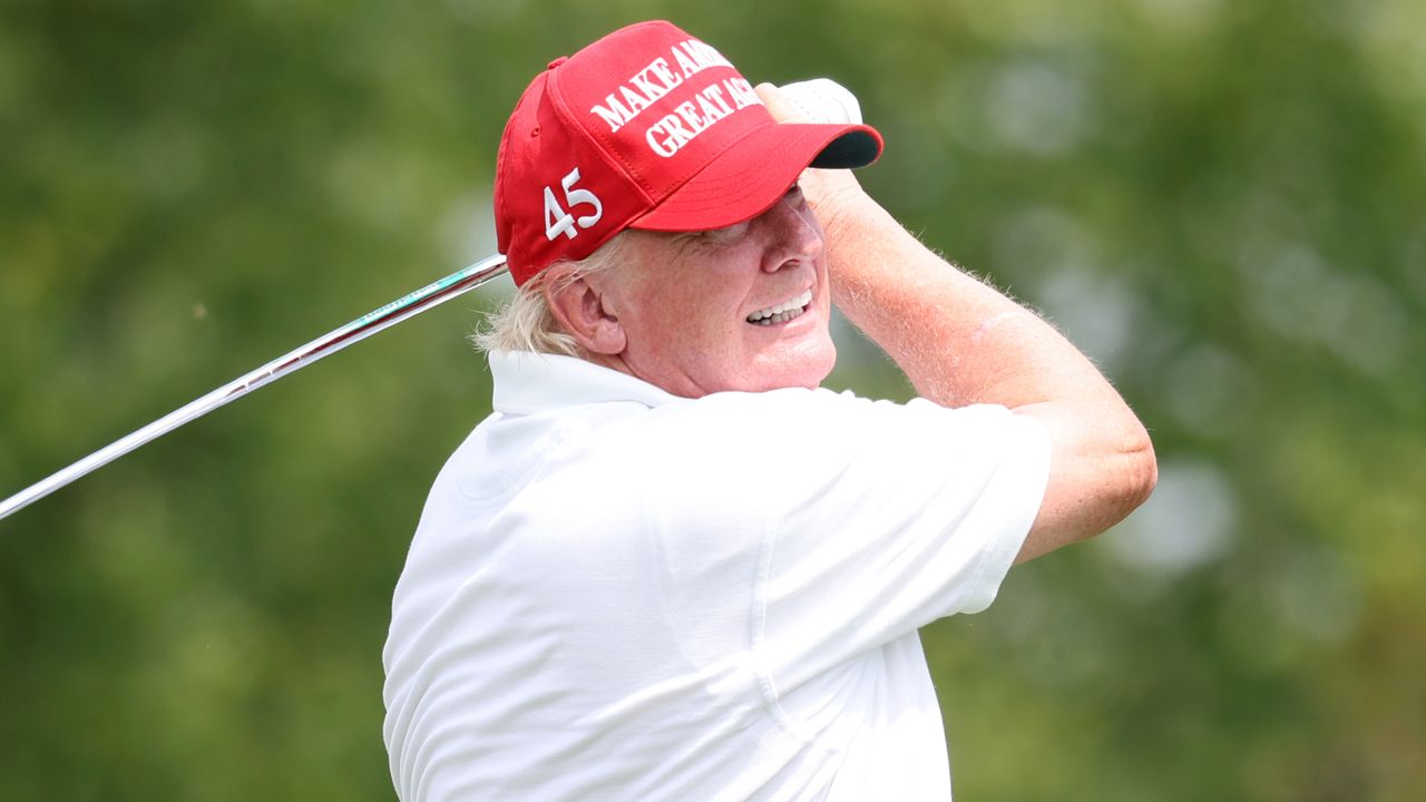 Donald Trump takes a shot during the pro-am before the LIV Golf Bedminster tournament in July 2022