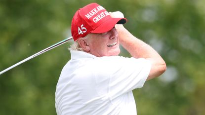 Donald Trump takes a shot during the pro-am before the LIV Golf Bedminster tournament in July 2022