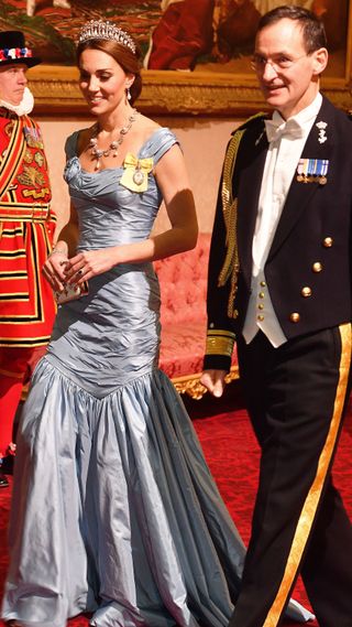 Catherine, Duchess of Cambridge walks with Rear Admiral Ludger Brummelaar