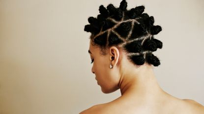 view of woman with natural hair from behind, over the shoulder