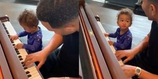 John Legend playing piano with son Miles
