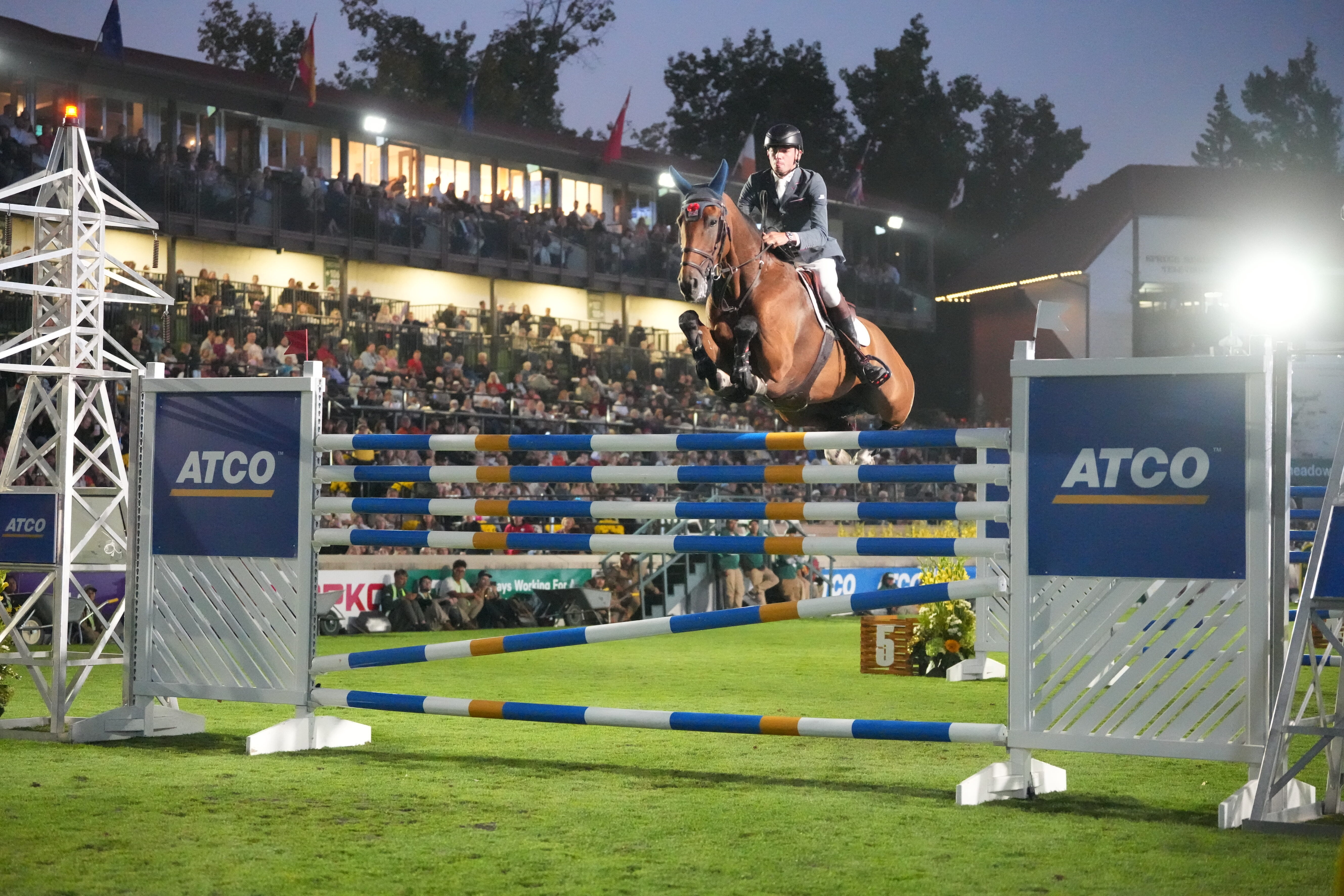 Joe Stockdale and It's Confidential clear 2.13m for a record-breaking win in the ATCO Electric Six Bar at the Spruce Meadows Masters in Canada.