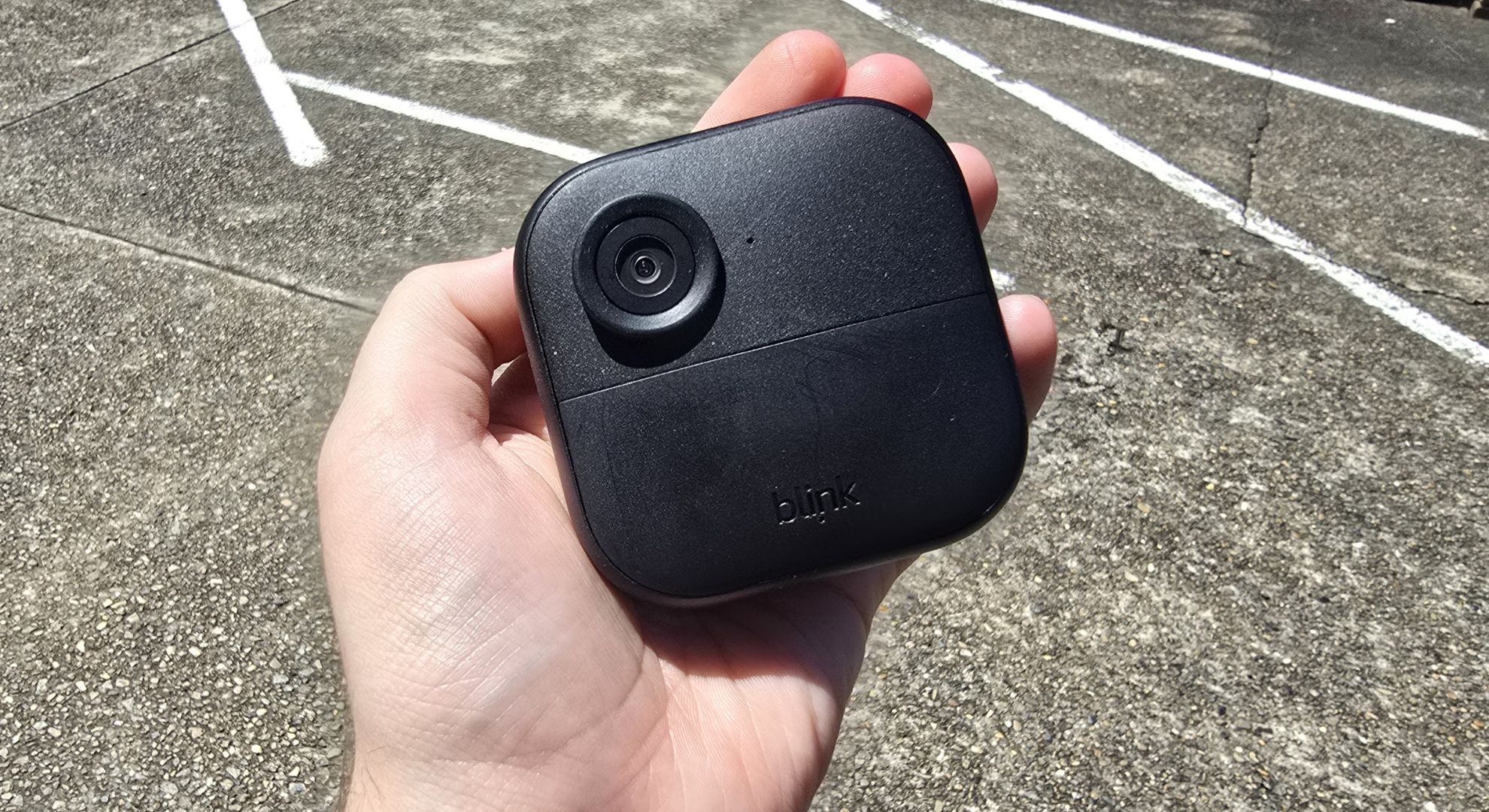 The Blink Outdoor 4 camera in hand