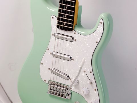 The sleek body, Motor City-influenced paint job and old-school vibrato unit of Squier's Vintage Modified Surf Strat are a '60s teen dream.