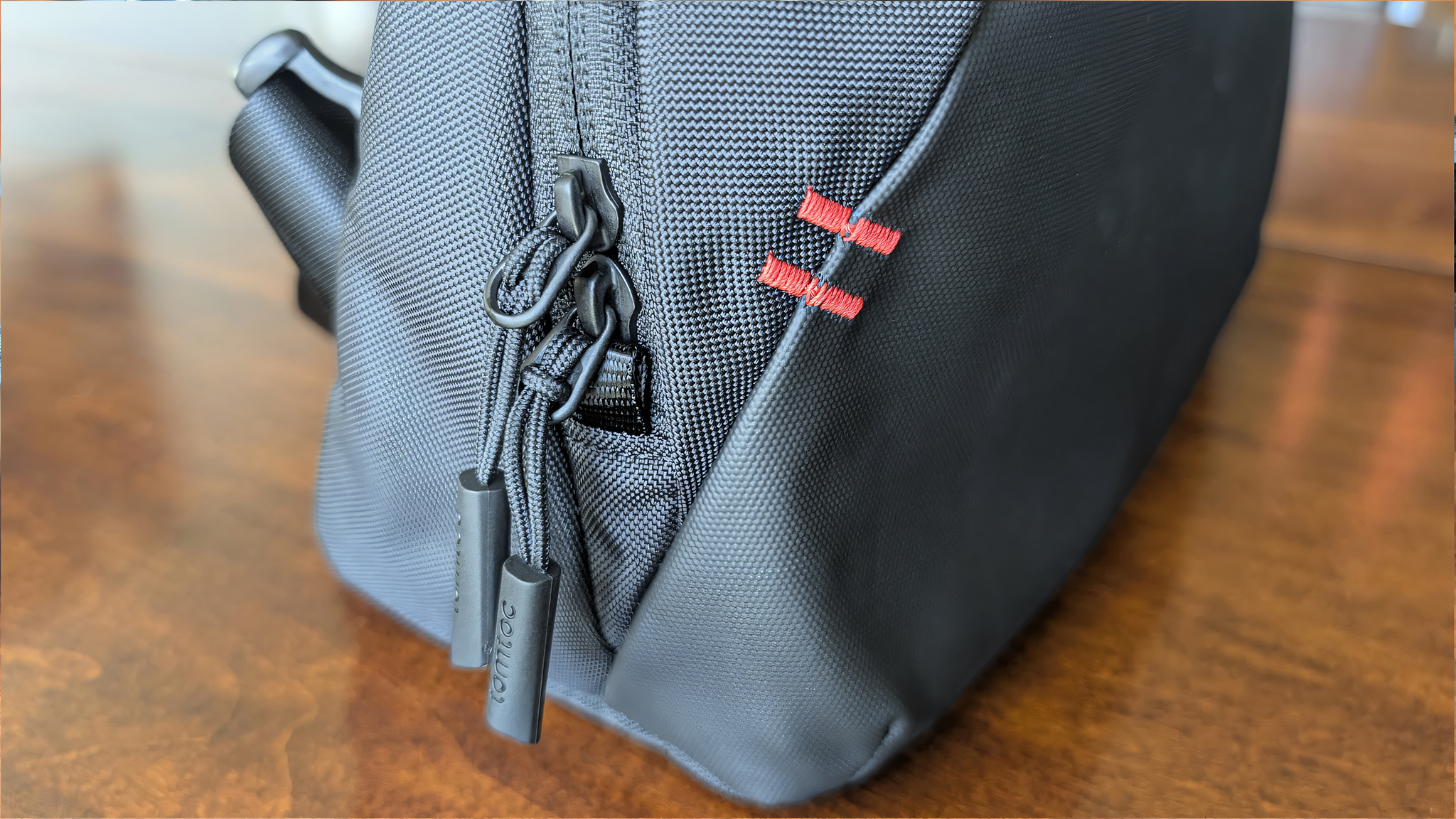 A closeup of the zippers on the Tomtoc Arccos G-47 Travel Bag.