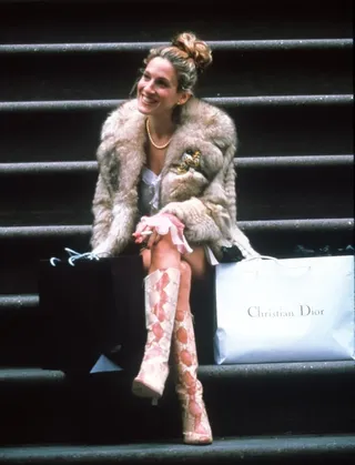 Carrie Bradshaw wearing snakeskin boots