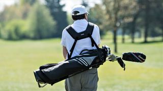 Inesis Ultralight Stand Bag being carried on the golf course