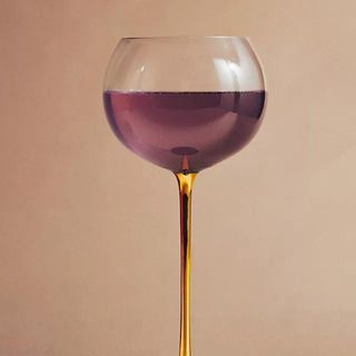 Starry wine glass on brown background.