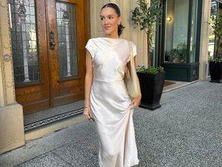 Emma Leger wearing a white silk dress