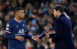 It was a disappointing night for Mauricio Pochettino (right) despite a goal from Kylian Mbappe (left)