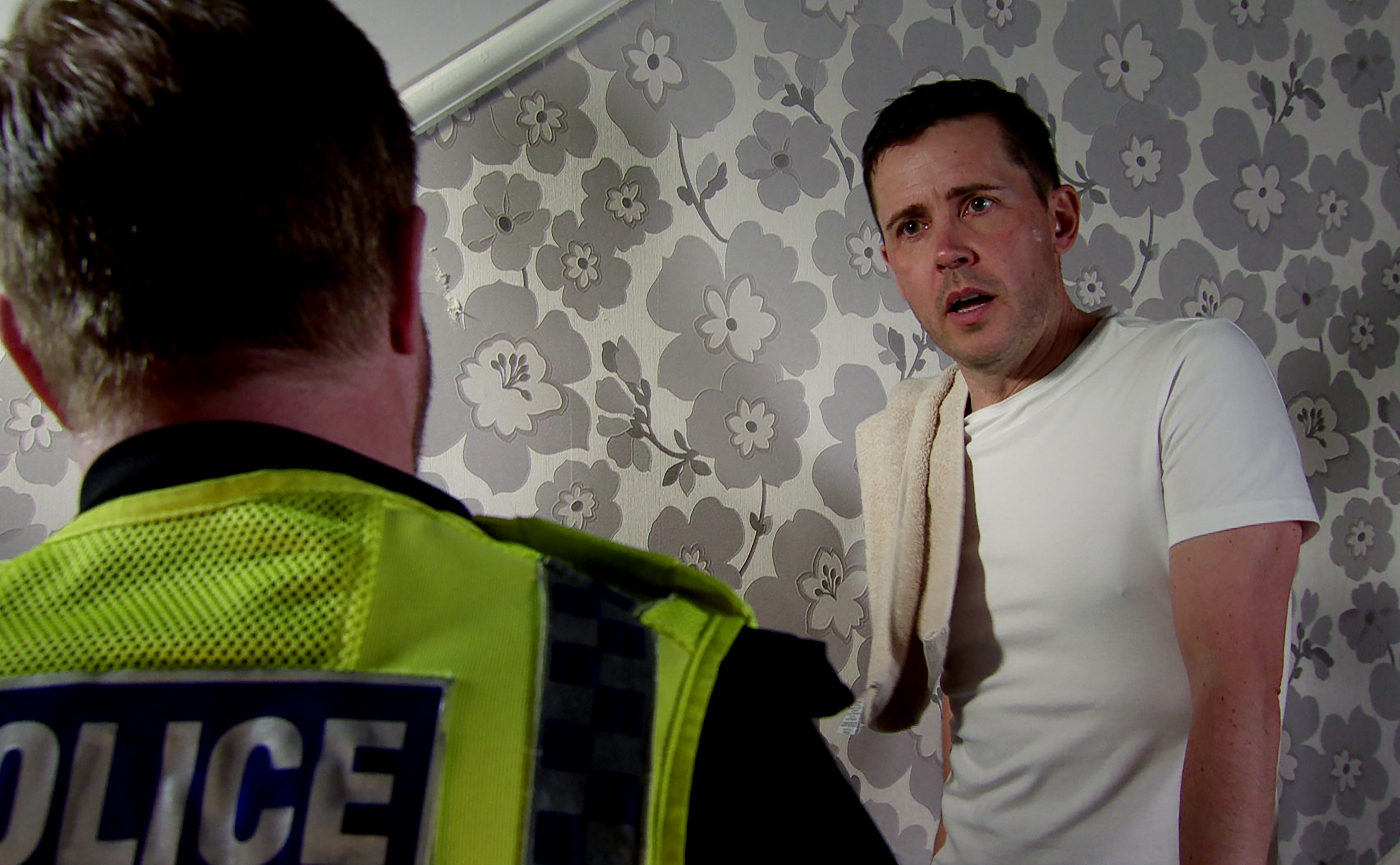 The police questioning Todd Grimshaw at his house