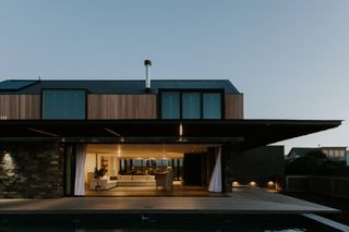 Dusk view, looking into 5 Fin Whale Way, a South African holiday home by SALT Architects