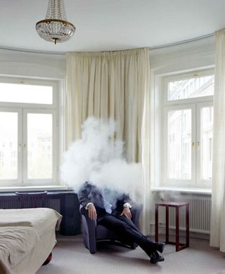 Man sat in smoke cloud