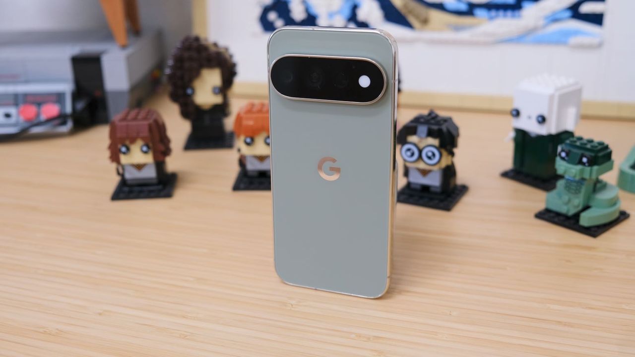 The Google Pixel 11 Pro resting on a wooden table