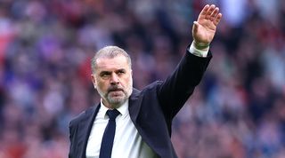 Tottenham manager Ange Postecoglou waves to fans during Spurs' Premier League game against Luton Town in March 2024.