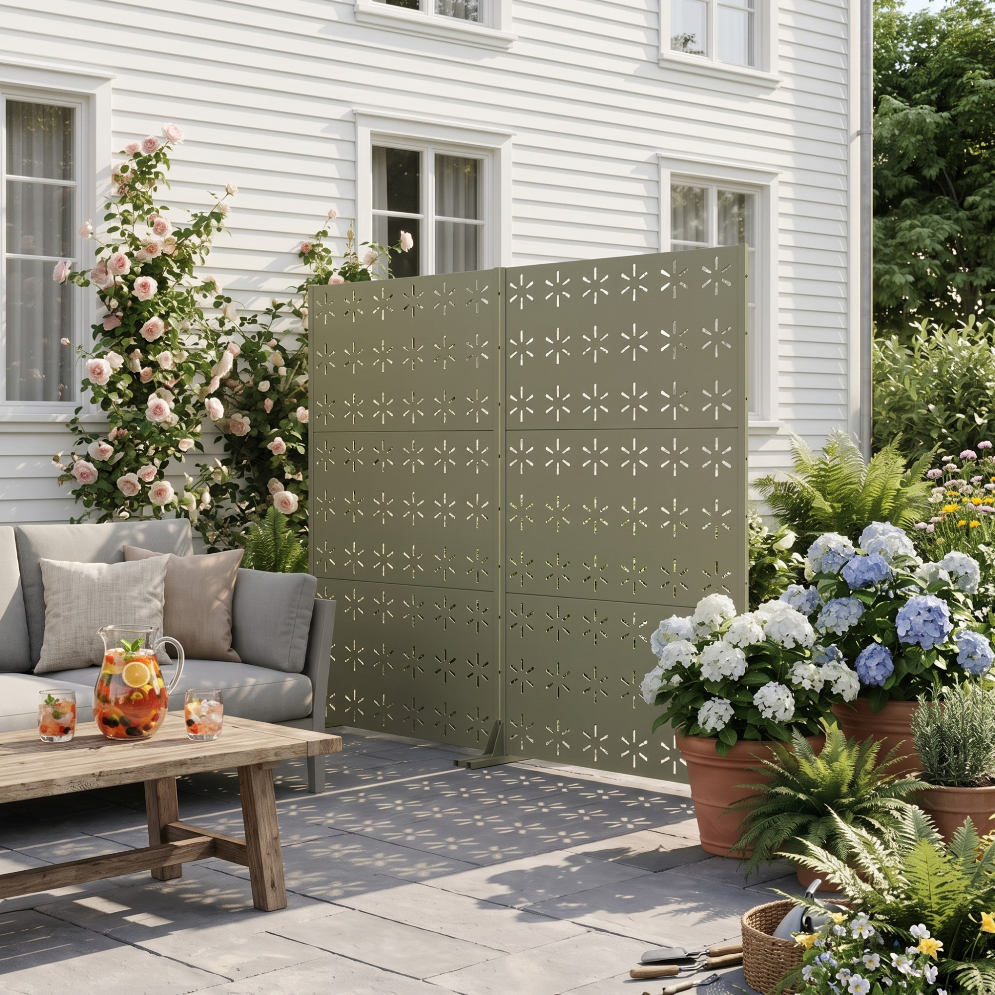 Privacy screens from Target's new range on a patio in a modern garden bringing shade as well as privacy