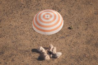 The Soyuz TMA-21 spacecraft is seen as it lands with Expedition 28 Commander Andrey Borisenko, and Flight Engineers Ron Garan and Alexander Samokutyaev in a remote area outside of the town of Zhezkazgan, Kazakhstan, on Friday, Sept. 16, 2011. 