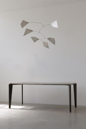 Table and mobile hanging above